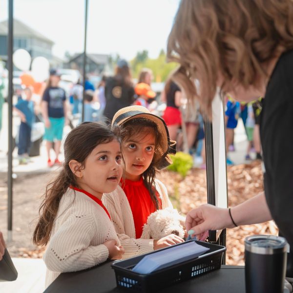 Kids at the Anthem tent at the Showhome opening event 2025 in Trumpeter by Big Lake.