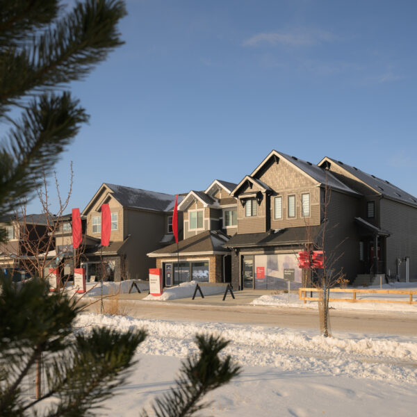 Row of front drive homes shown in winter in Trumpeter by Big Lake, Edmonton, Alberta.